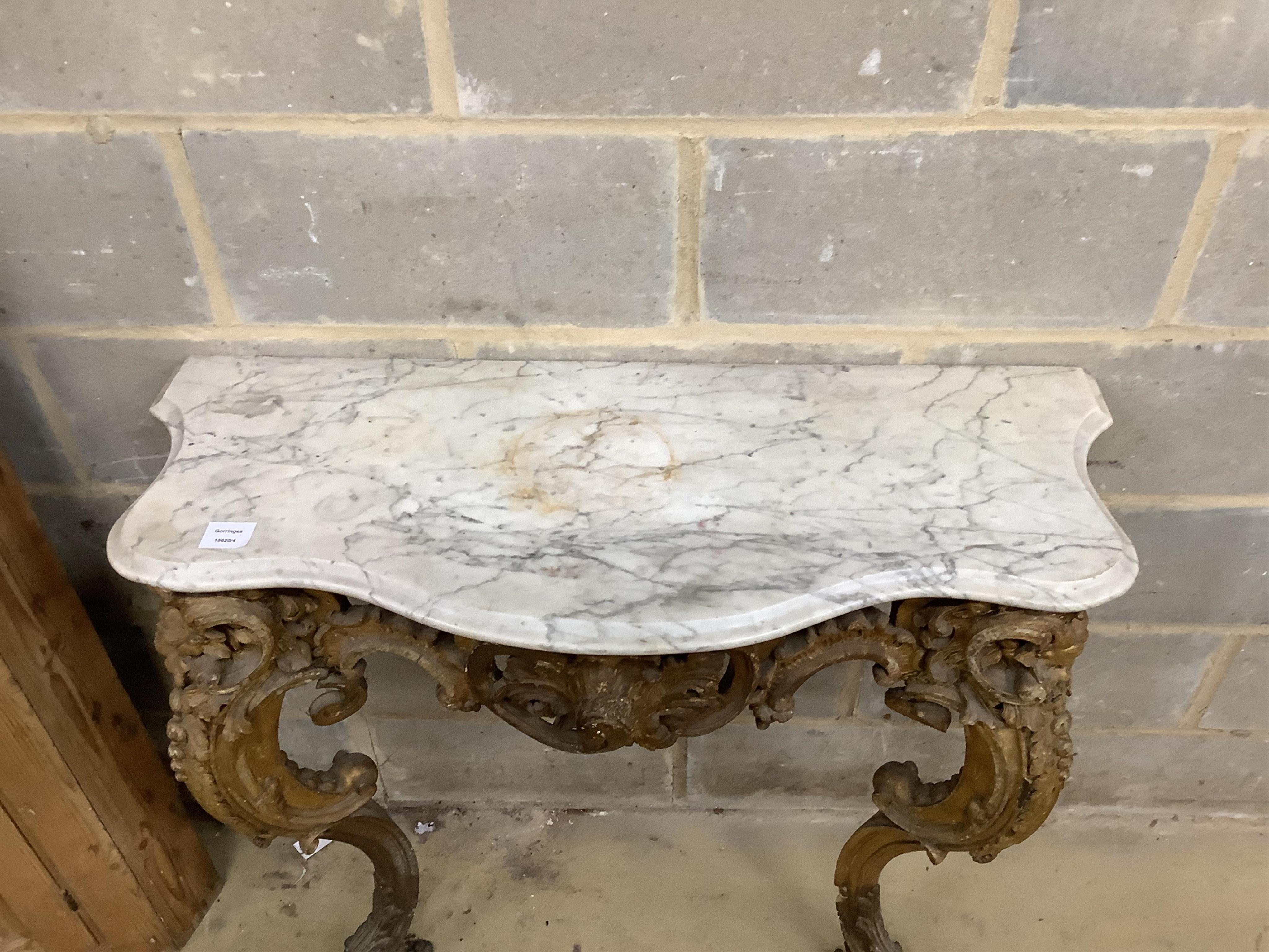 A Victorian giltwood and composition marble top serpentine console table, width 93cm, depth 37cm, height 90cm. Condition - fair